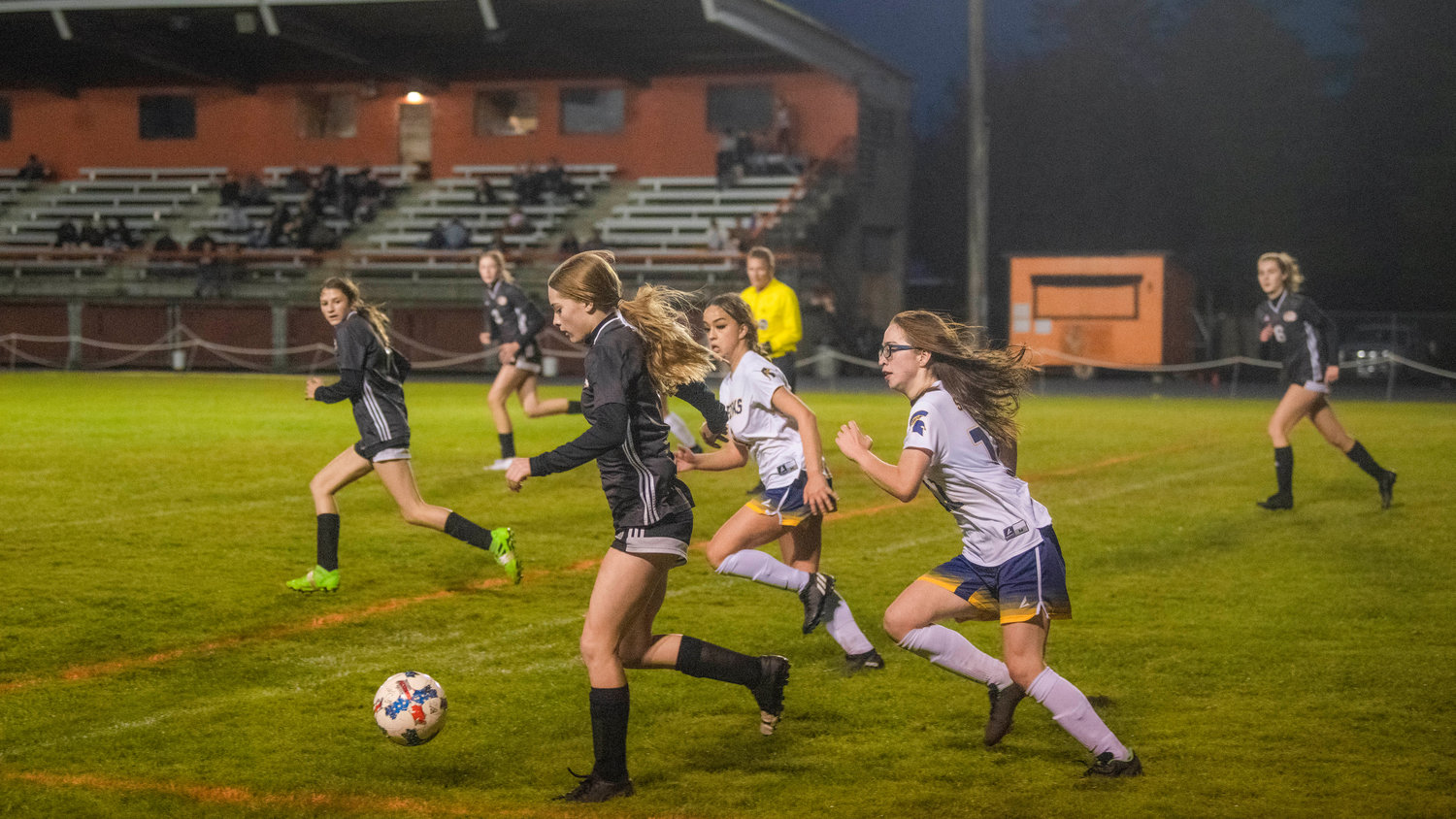 Tigers take control of the ball and move it down the field Monday night during a game against Forks.
