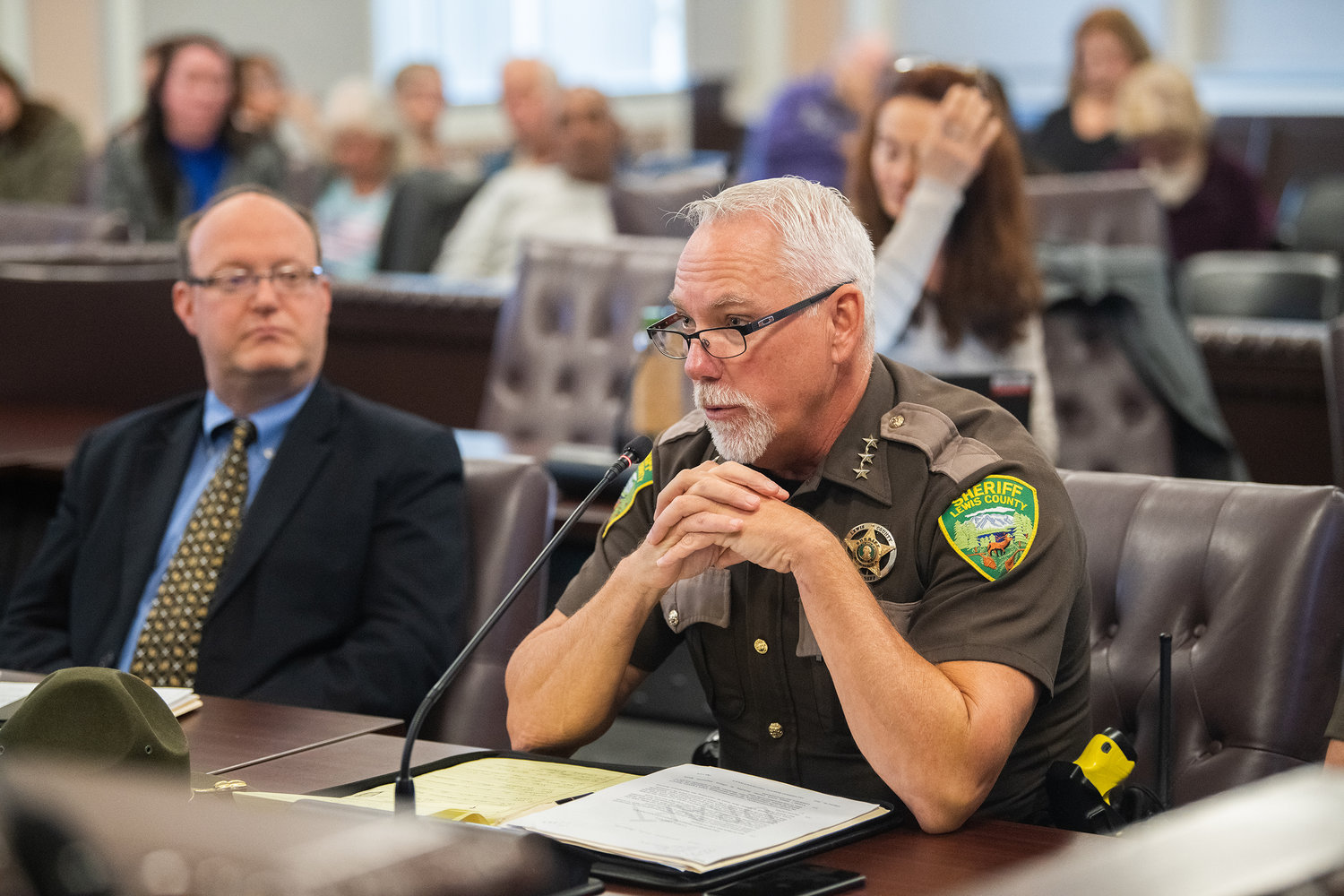 Sheriff Rob Snaza talks about homeless encampments across Lewis County during a meeting where an ordinance passed prohibiting unauthorized camping on county land adopting a resolution for homeless camp removals and site clean ups on Tuesday in Chehalis.