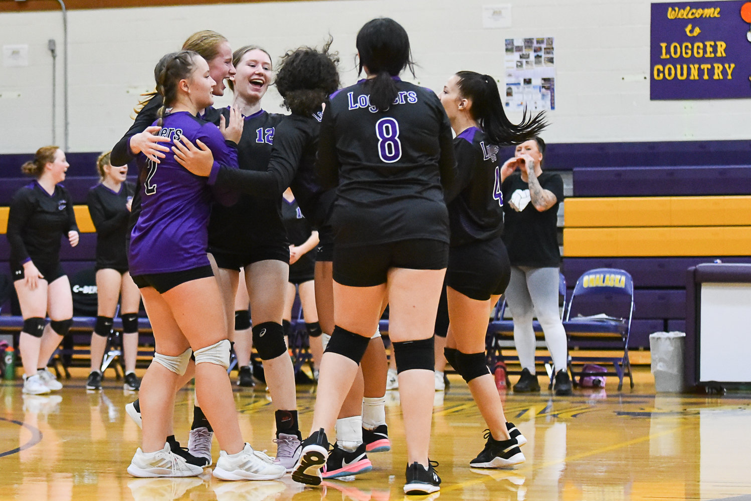 Onalaska celebrates its set-winning point in the first set of the Loggers' match against Toledo on Oct. 26.