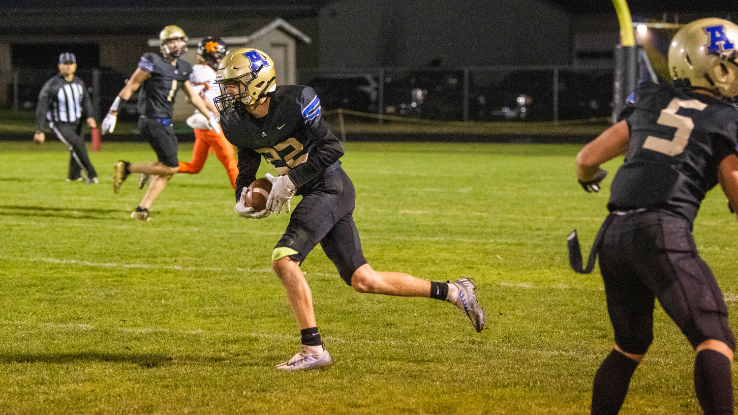 Adna senior Seth Meister (22) runs with the football after making an interception Thursday night during a game against Kalama.