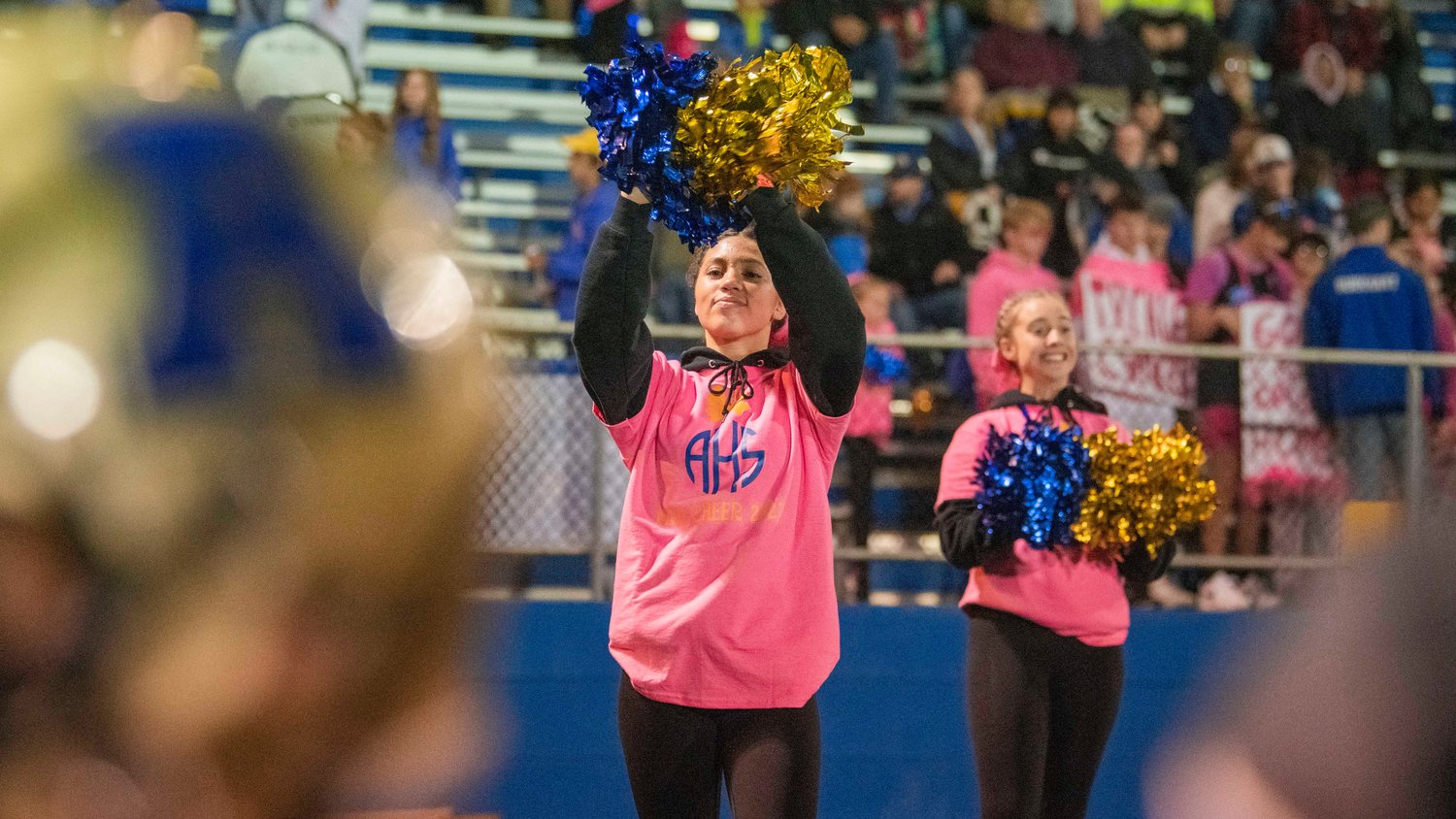 Adna cheerleaders wave their pom-poms during a Thursday night game at Pirate Stadium.