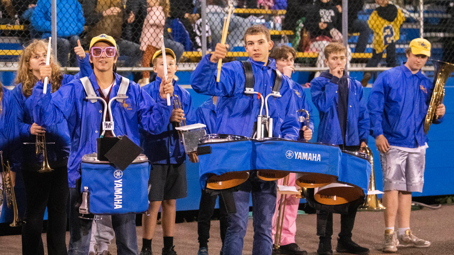 Members of the Adna High School band prepare to take the field at halftime during a Thursday night game at Pirate Stadium.