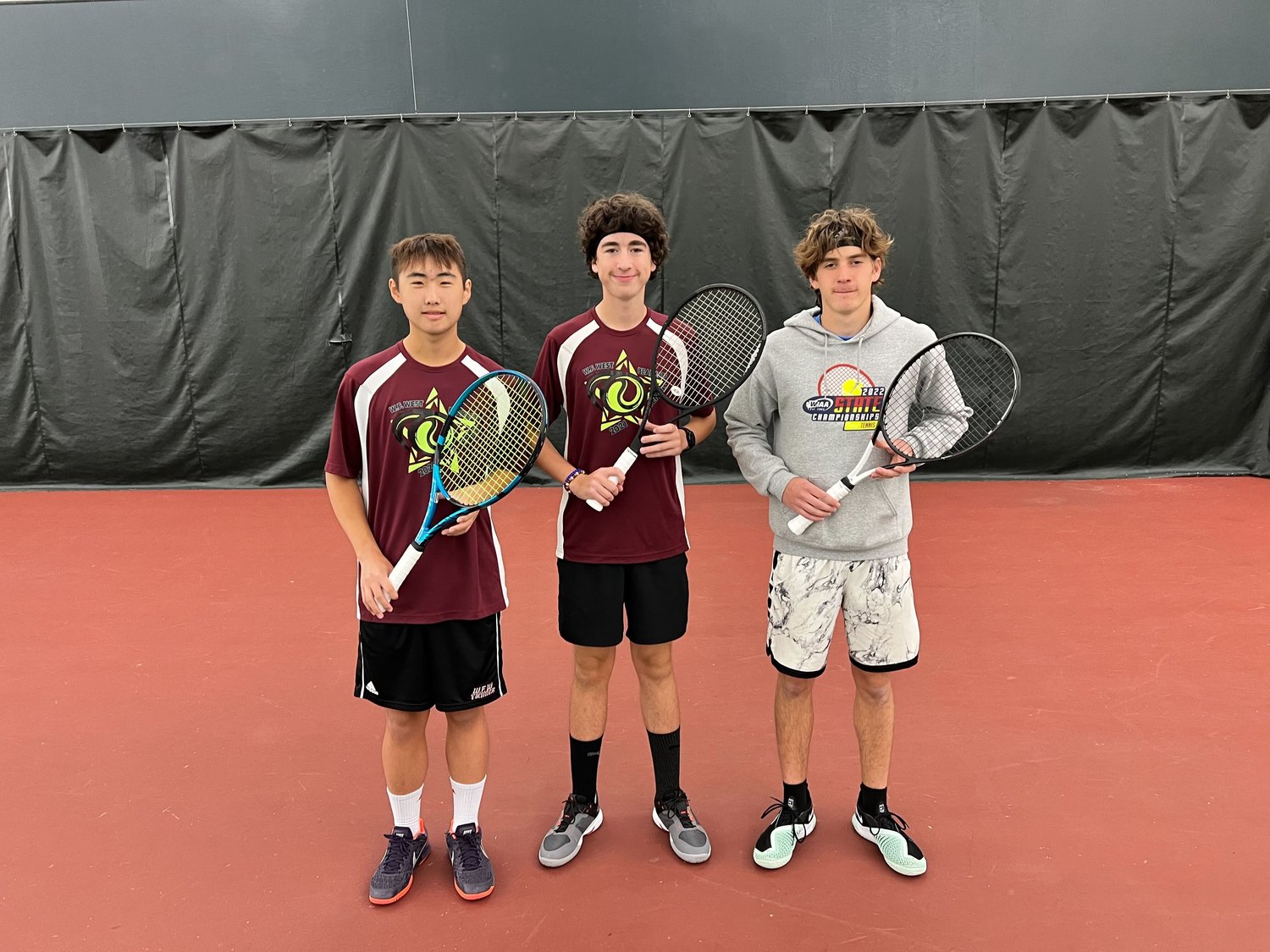 W.F. West tennis players Javyn Han, Bryce Kuykendall, and Aaron Boggess pose for a photo after the 2A District 4 Boys Tennis tournament Oct. 28.