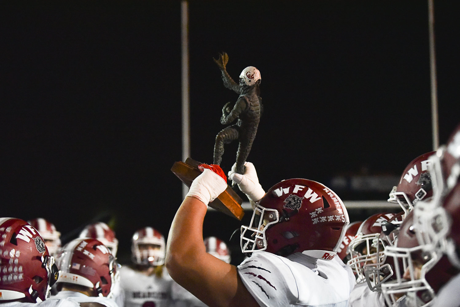 Daniel Matagi holds up the Swamp Cup after W.F. West's 55-7 win over Centralia at Tiger Stadium on Oct. 28.
