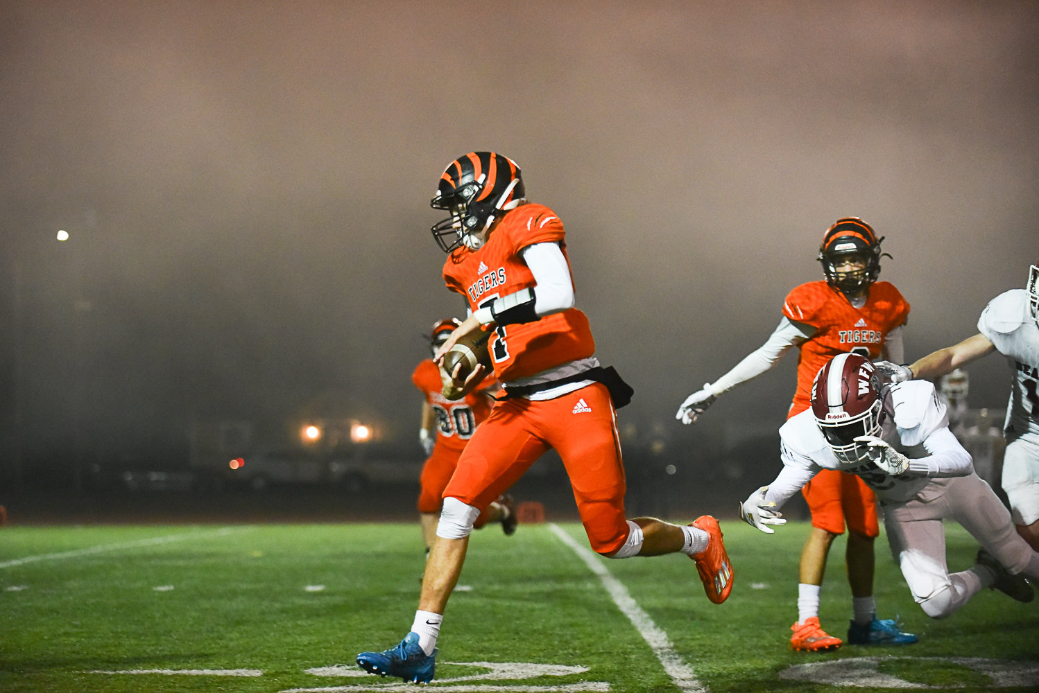 Centralia quarterback Tommy Billings runs through the fog and the W.F. West defense in the fourth quarter of the Tigers' 55-7 loss to the Bearcats on Oct. 28 at Tiger Stadium.