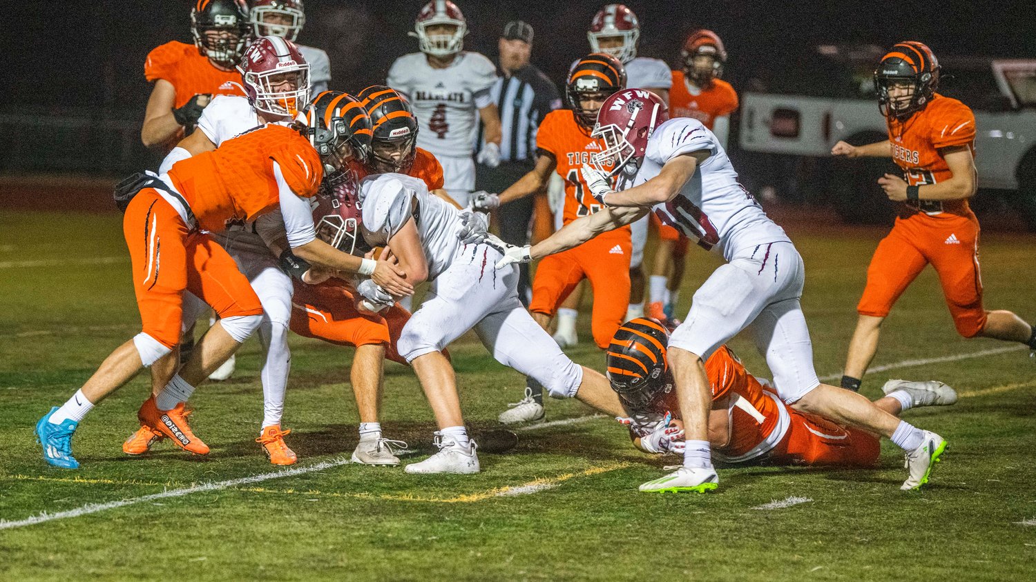 W.F. West sophomore Tucker Land (7) lowers his shoulder and crosses the goal line for a score Friday night at Tiger Stadium.