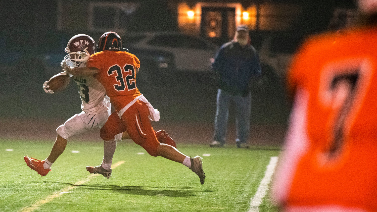 W.F. West senior Evan Stajduhar (23) runs through Tigers with the football during a Friday night game in Centralia.