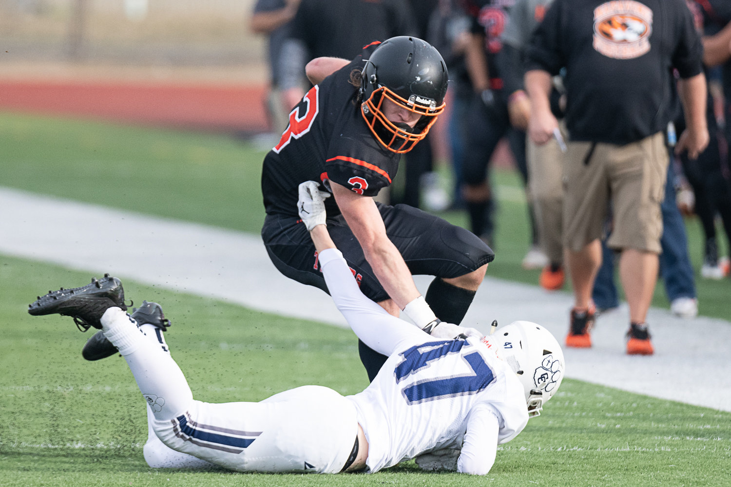 Napavine receiver Max O'Neill stiff arms a Cascade Christian defender to the ground in the Tigers win at Centralia Tiger Stadium Oct. 29.