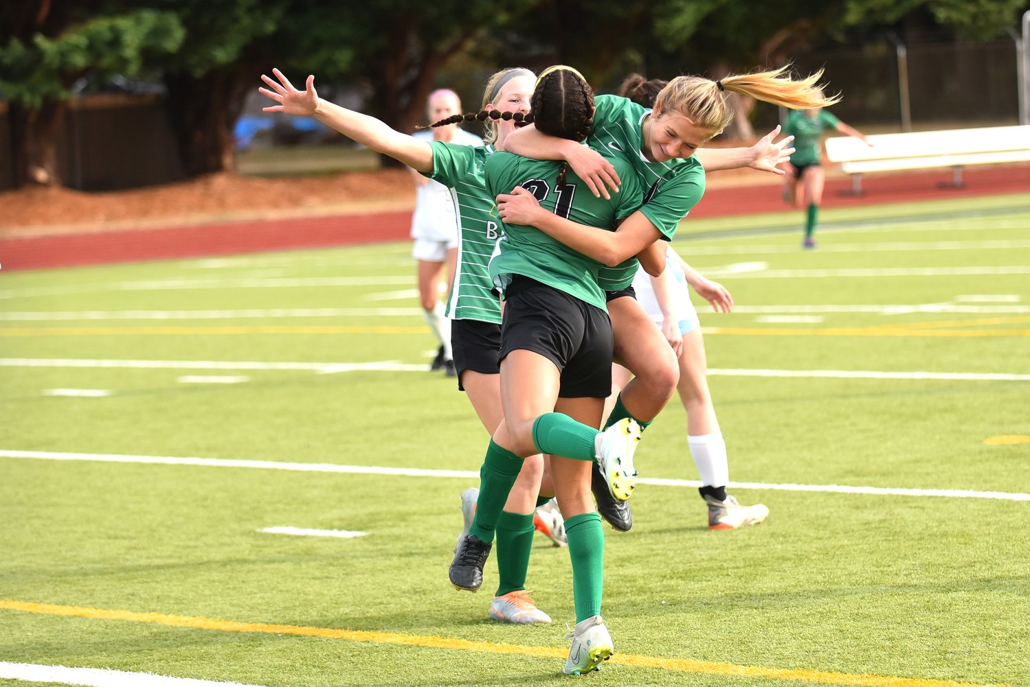 Tumwater's Ava Jones (21) celebrates with Emalyn Shaffer after the latter's goal put the Thunderbirds ahead 2-0 in their 6-0 win at home over Hockinson in the first round of the 2A District 4 tournament on Oct. 29.