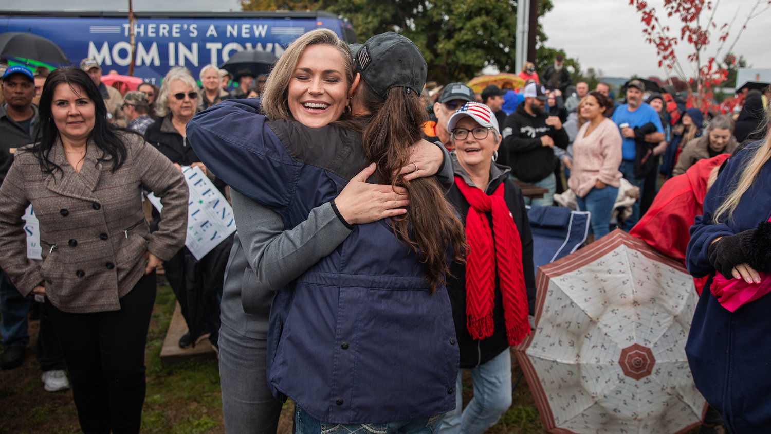 U.S. Senate candidate Tiffany Smiley hugs supporters in front of her tour bus during a stop in Adna on Sunday.