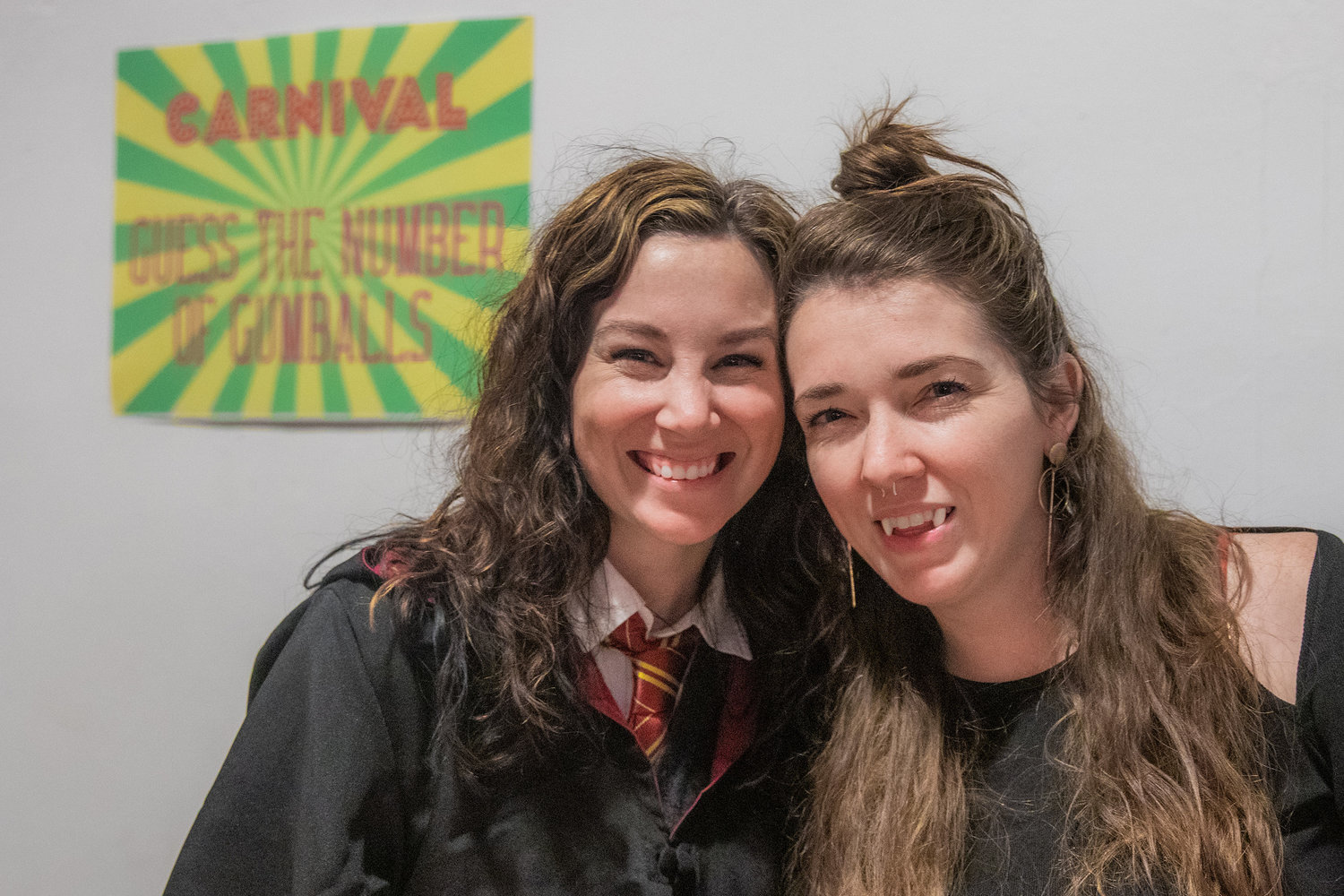 Organizers Naomi Robb and MacKenzie McGee pose for a photo during a Halloween Carnival at The White Space in downtown Centralia on Monday.