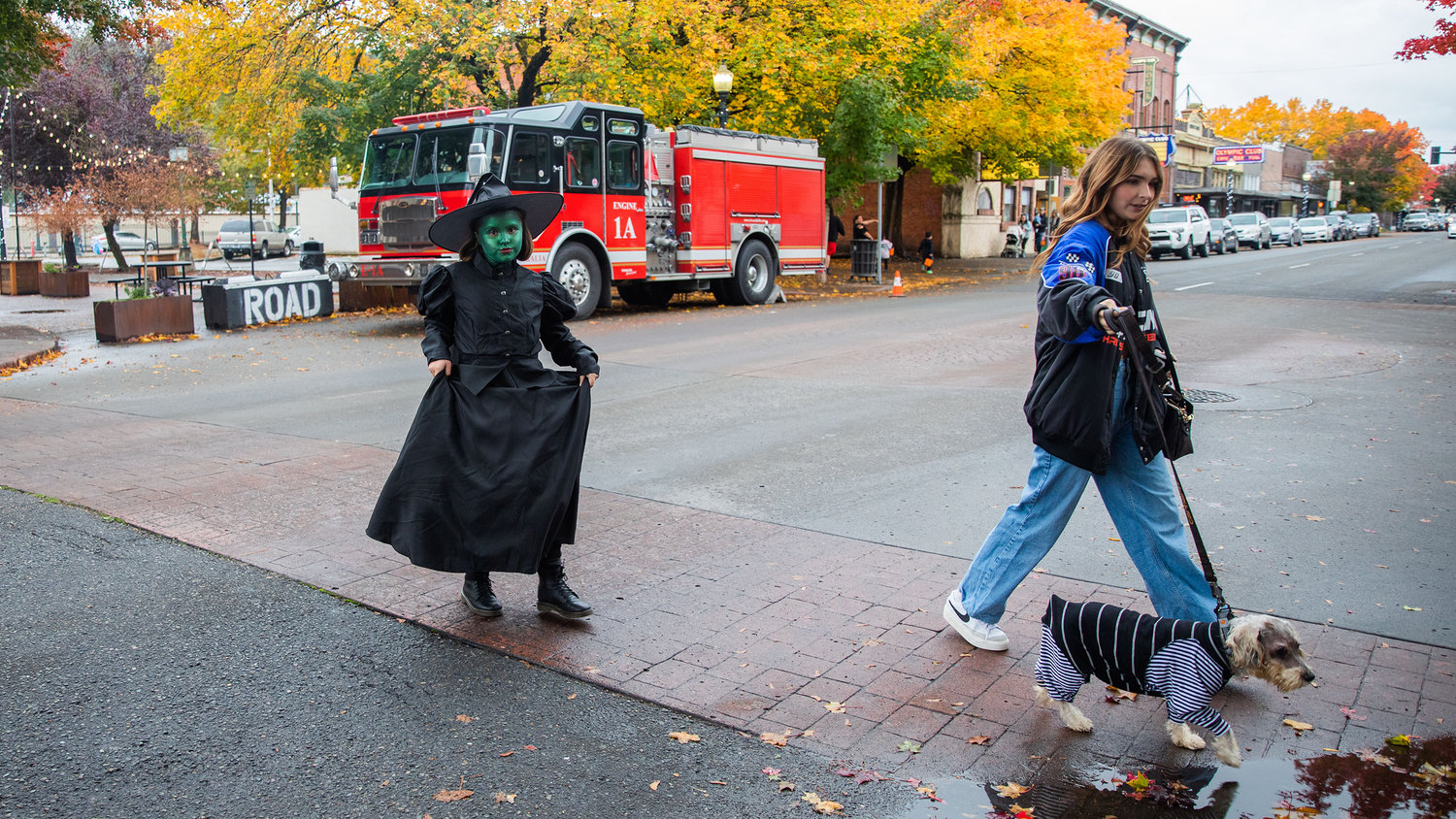 Charlee Potter, 9, walks through downtown Centralia on Monday while dressed as the Wicked Witch of the West for Halloween.