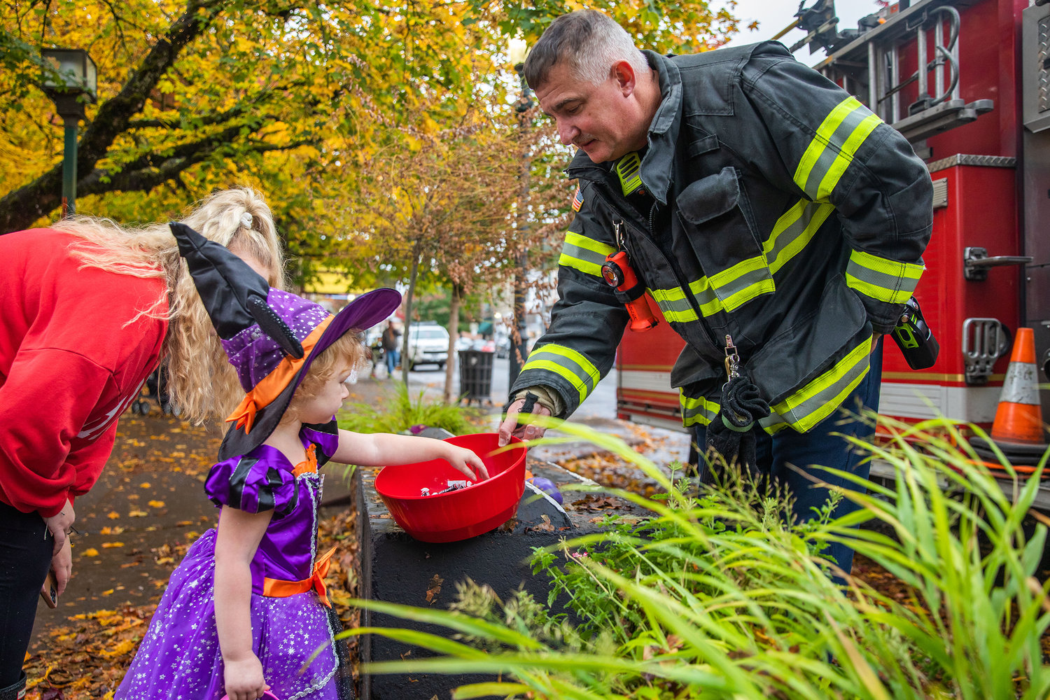 Firefighters hand out candy in downtown Centralia on Halloween.
