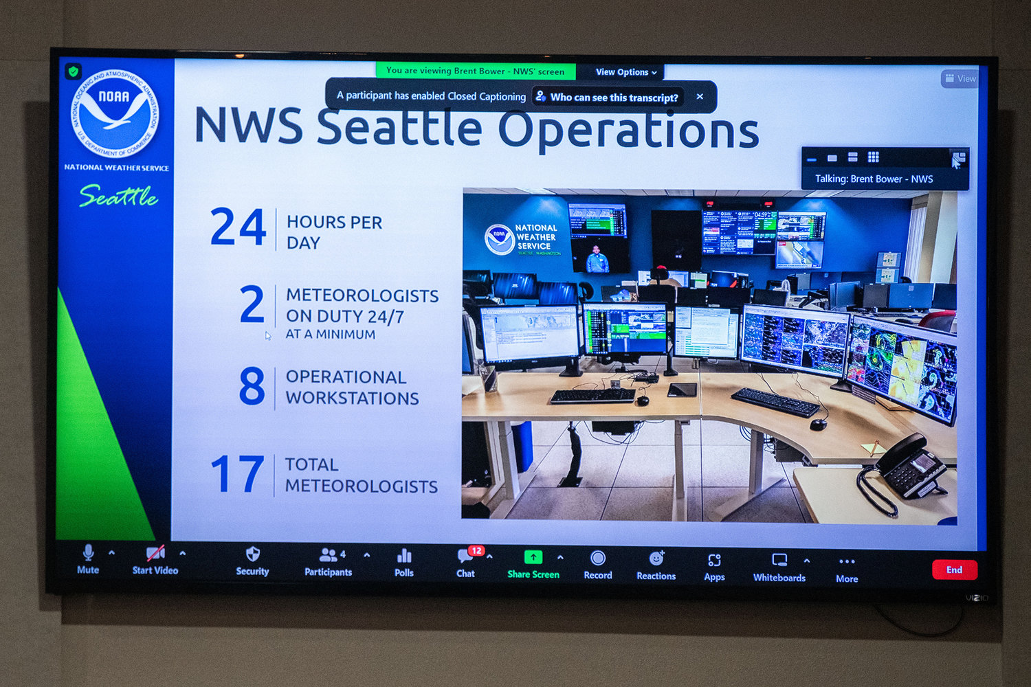 An image and information about the National Weather Service Seattle Operations is displayed during the annual flood meeting at Jester’s Auto Museum in Chehalis on Thursday.
