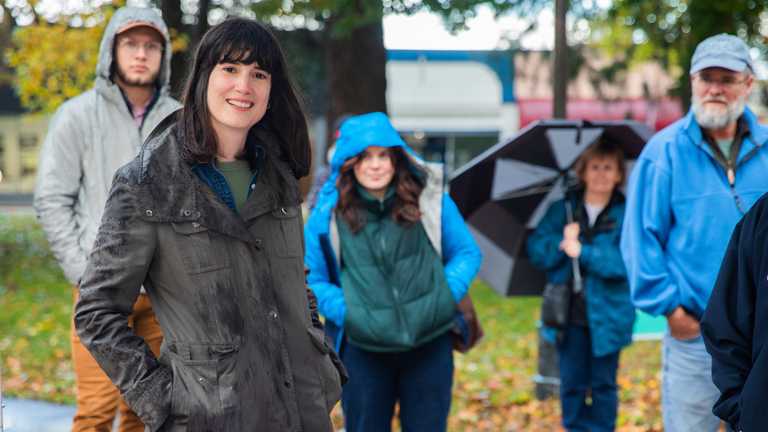 Marie Gluesenkamp Perez smiles alongside supporters Saturday afternoon outside the Centralia Timberland Library.