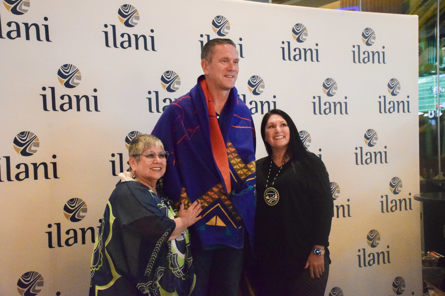 Former NFL quarterback and Washington State University alum Drew Bledsoe receives a Cowlitz Indian Tribe blanket from tribal general council chair Patty Kinswa-Gaiser, left, and council member Suzanne Donaldson during a grand opening for sports betting on Nov. 6.