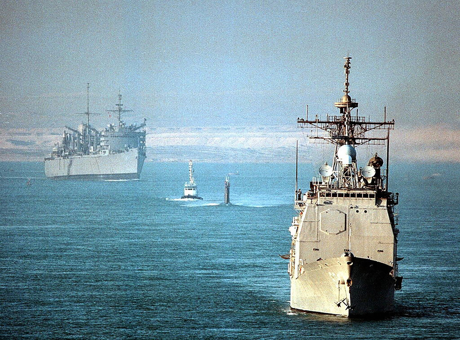 The USS Normandy, front, crosses the Suez Canal on Nov. 16, 1997. Simon McKeon, captain of the guided-missile cruiser, was relieved of his duties. (Jason Dent/AFP/Getty Images/TNS)
