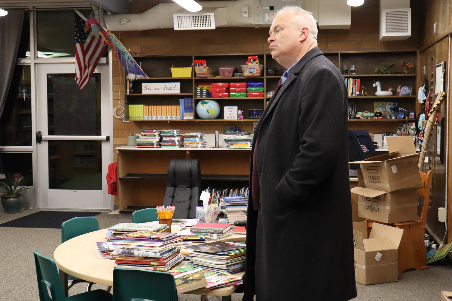 State representative Jim Walsh tours the Oakville Elementary School library during an open house on Wednesday.