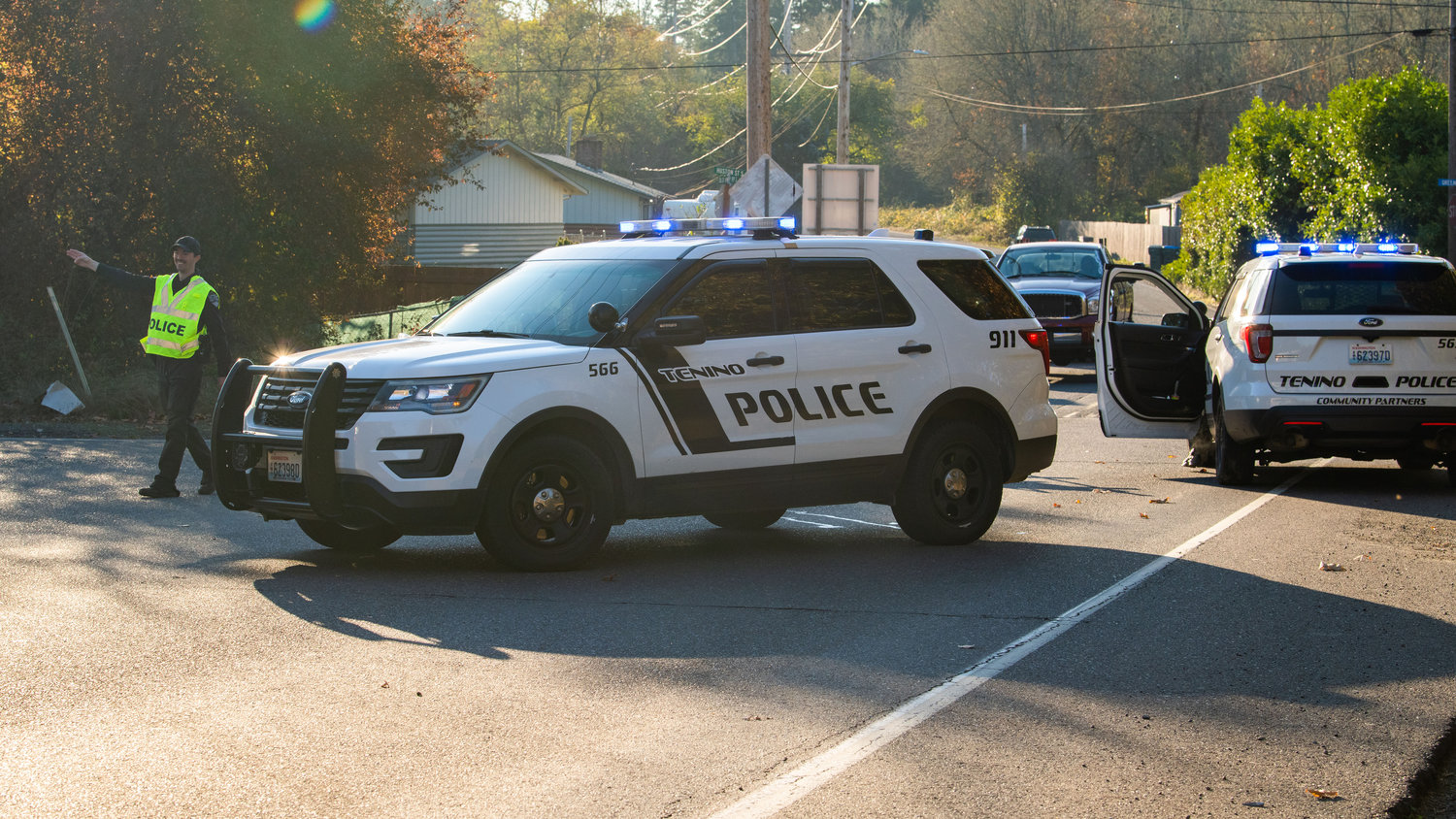 A Tenino Police officer reroutes traffic to Centralia on Monday while law enforcement investigates the scene of an officer involved shooting along Old Highway 99 SE.
