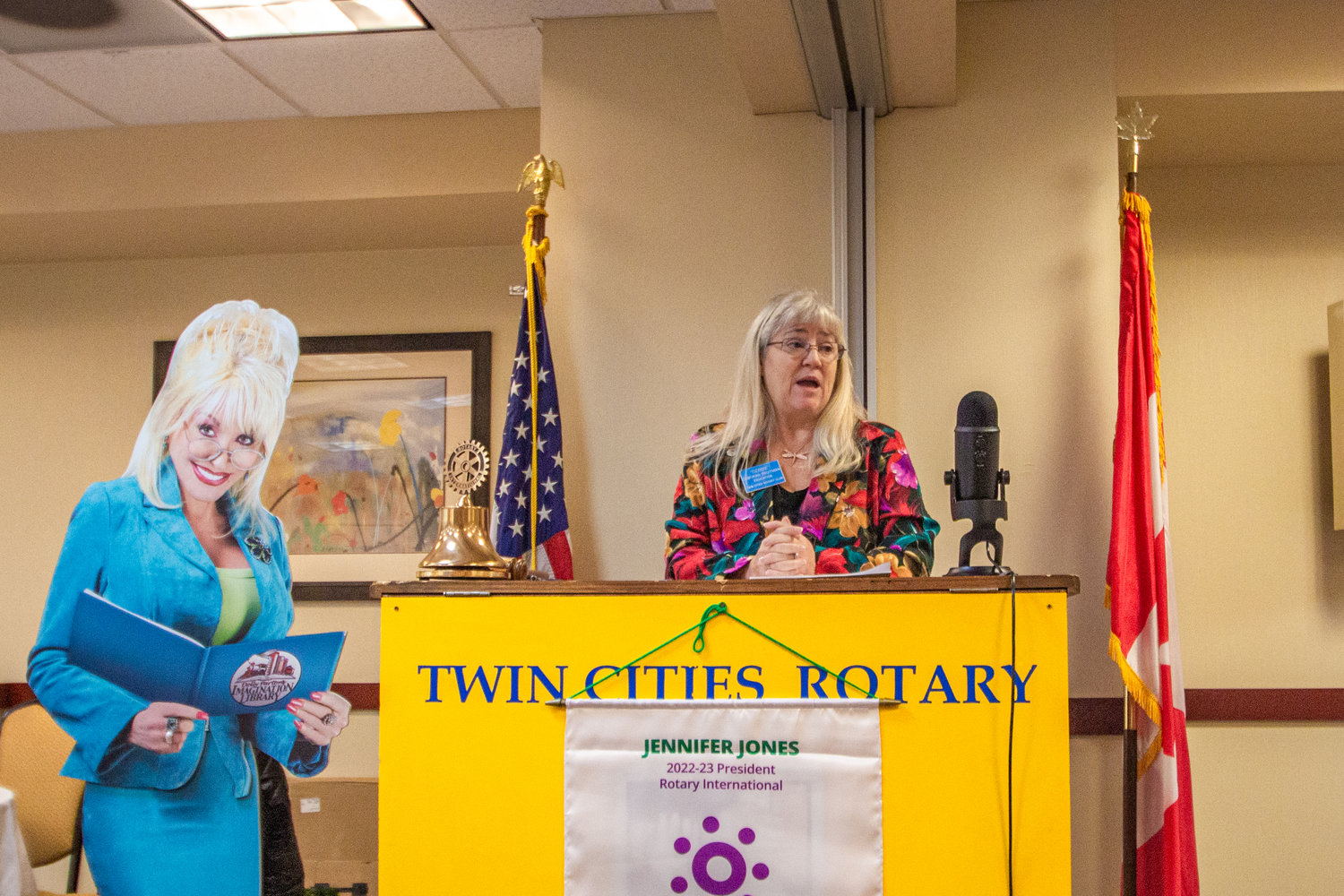 Twin Cities Rotary President Deborah Fruitman speaks about the benefits of reading for early childhood education to Rotarians at the Holiday Inn in Chehalis on Friday as the club celebrated the three-year anniversary of the Dolly Parton Imagination Library sun Lewis County.