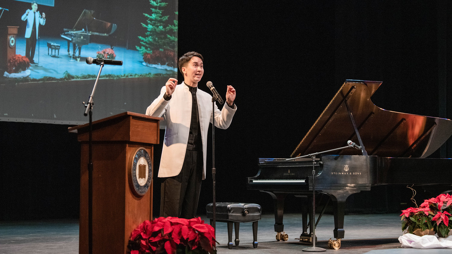 Piano virtuoso Charlie Albright talks to attendees gathered in the Corbet Theatre Friday evening for a “Classical Christmas Fundraiser Concert,” with proceeds going to the Charlie Albright Scholarship at Centralia College.
