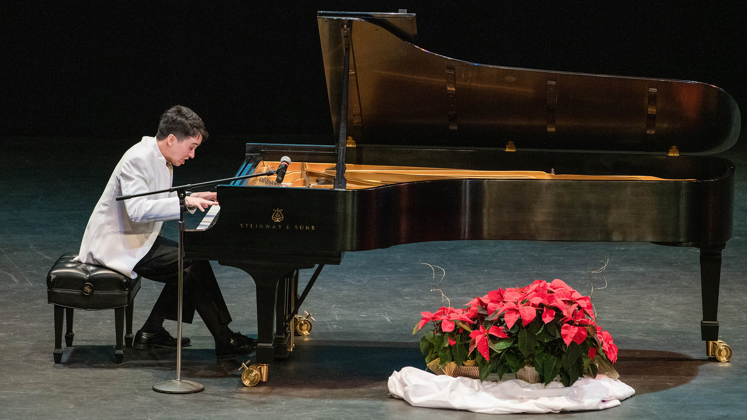 Charlie Albright performs “I’ll Be Home for Christmas,” for an audience on a nine-foot Steinway & Sons grand piano inside the Corbet Theatre Friday evening with proceeds going to the Charlie Albright Scholarship at Centralia College.