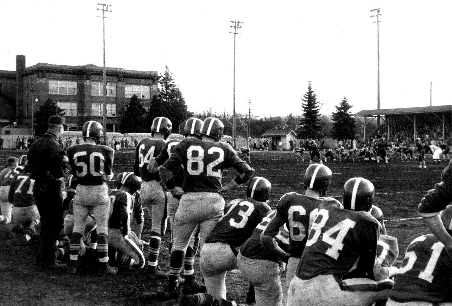 This photo from 1958 or 1959 shows the Thanksgiving football game between Centralia and Chehalis. The game was played at Noble Field at the old Centralia High School, which was eventually leveled to make room for Centralia College. Chehalis coach Bill Stefon, at left, is shown talking with Allan Allie, No. 50, a future Pe Ell coach. This photo and information originally submitted by Bill Stefon for Our Hometowns.
