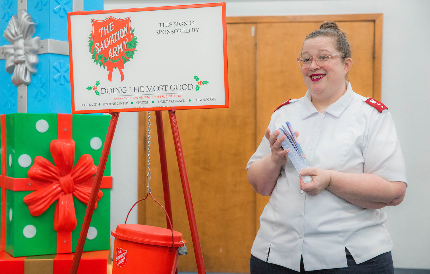 Captain Gin Pack, with The Salvation Army, smiles while talking about a $10,000 donation to the Red Kettle campaign by a local church, Monday in Centralia.