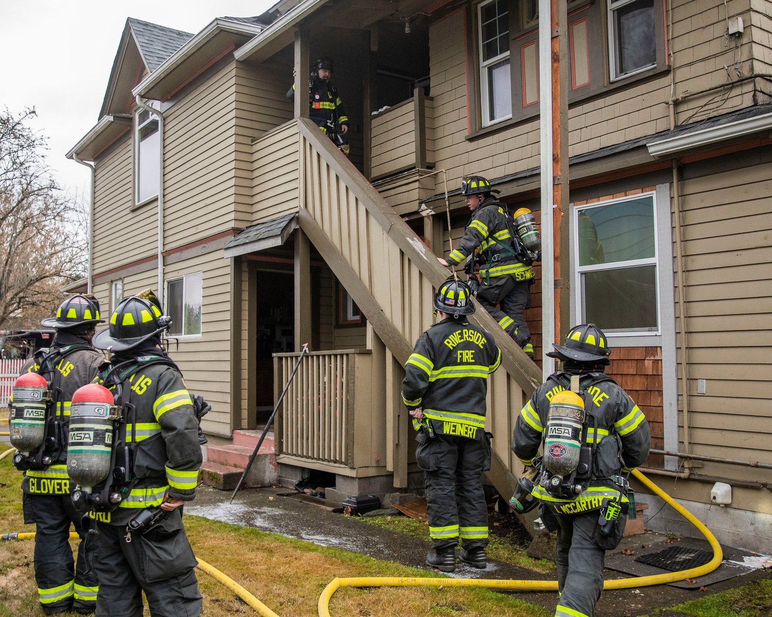 Riverside firefighters respond to the scene of a residential fire in the 200 block of North Rock Street in Centralia on Friday.