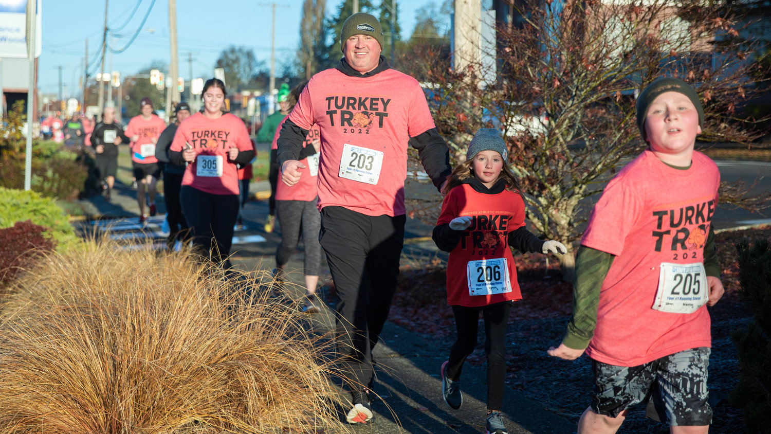 Members of the Noren family participate in the Turkey Trot 5K Thanksgiving morning while running to and from Thorbeckes in Chehalis.