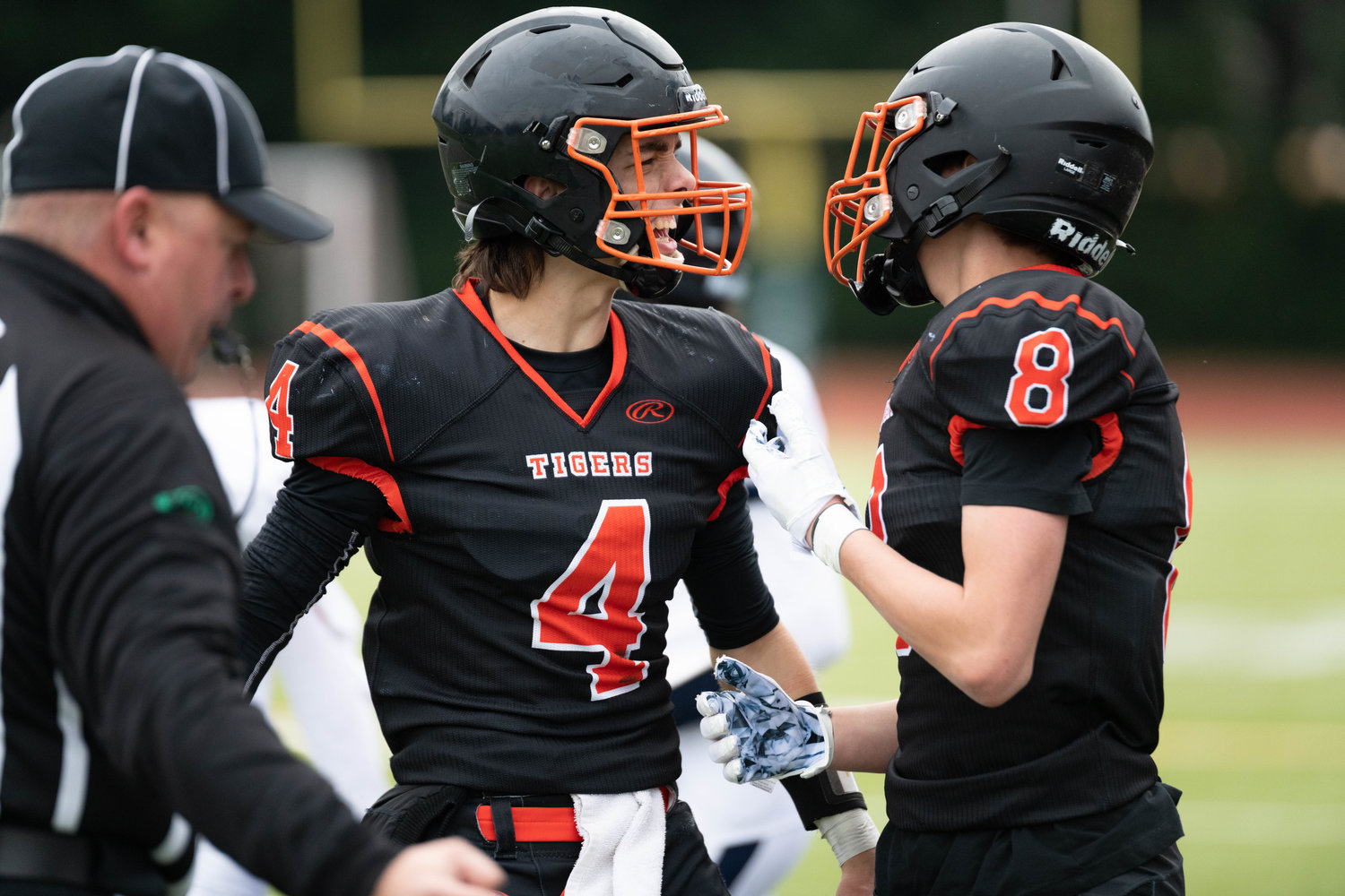 Ashton Demarest celebrates a defesnive stop with James Grose during the first quarter of Napavine's 2B semifinal win over Chewelah at Tumwater on Nov. 26.