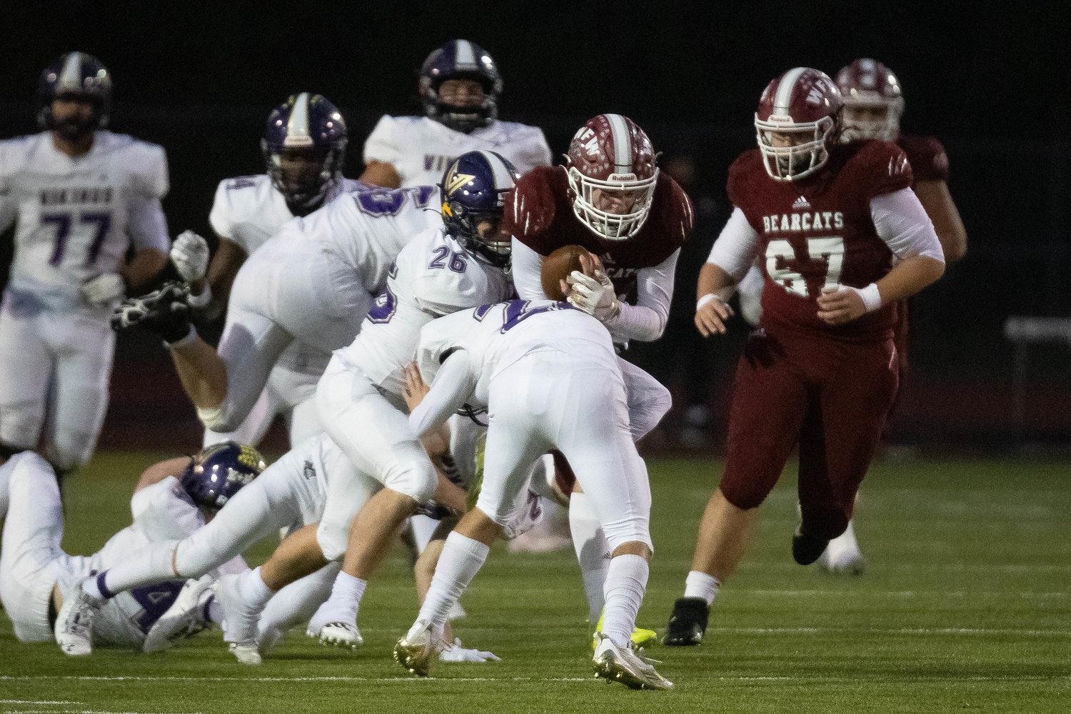 W.F. West quarterback Gavin Fugate is bottled up by defenders against North Kitsap in the 2A state semifinals Nov. 26 at Tumwater District Stadium.