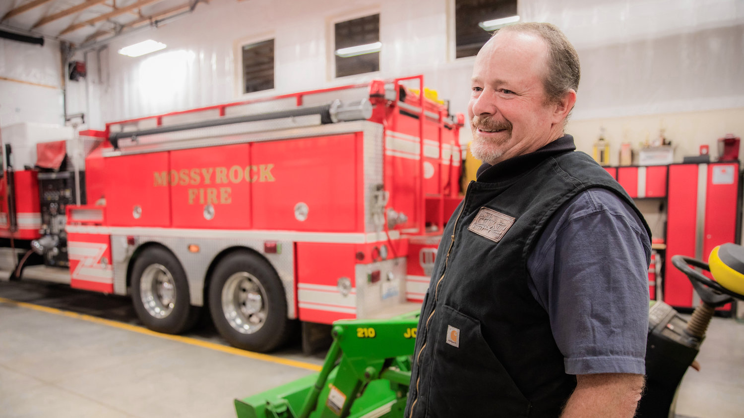 Marty Majors smiles while talking about the work firefighters do Monday night at the Lewis County Fire District 3 building in Mossyrock.