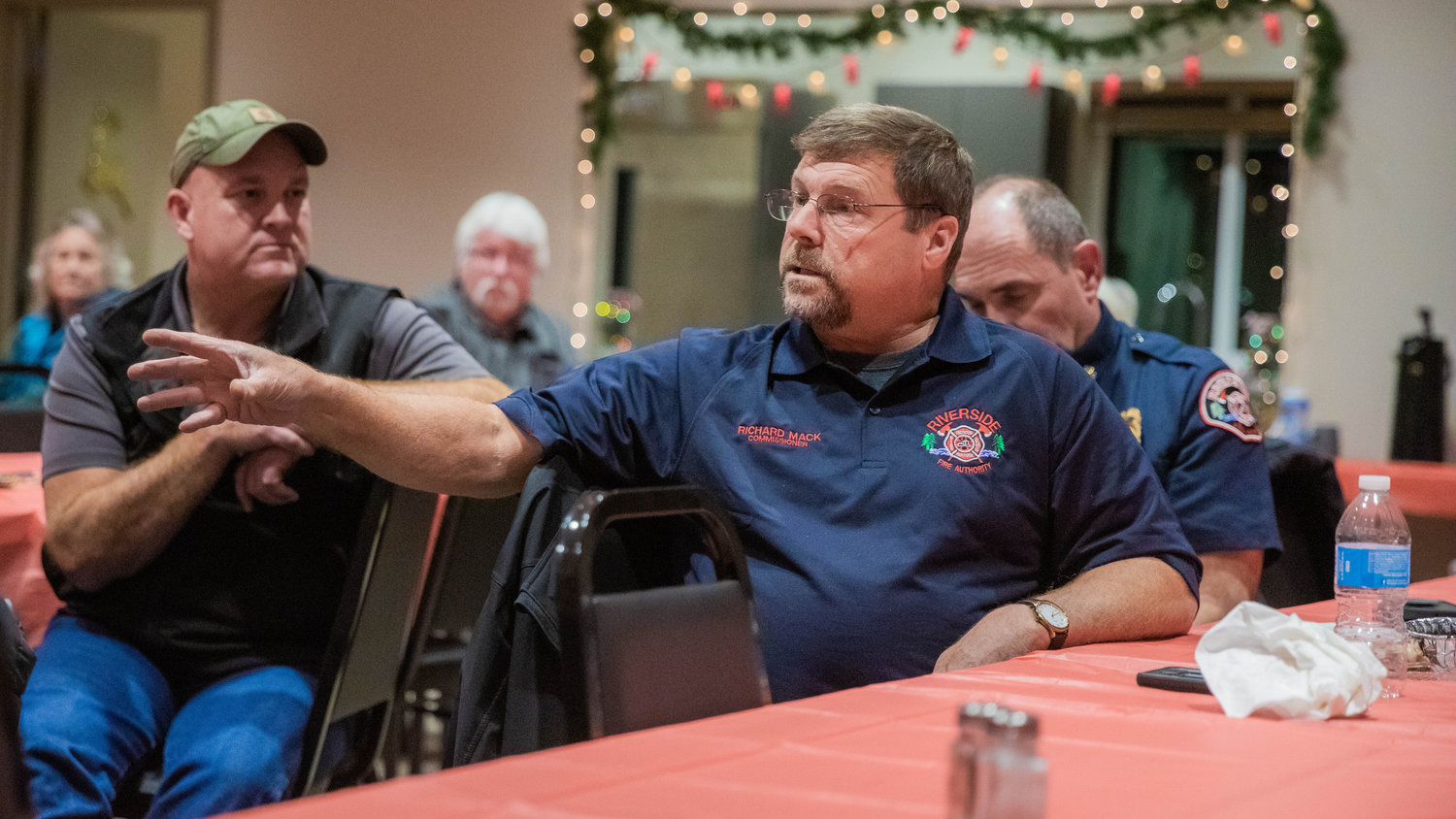 Fire Commissioner Richard Mack, of Riverside Fire Authority, talks about the importance of education around fire alarms Monday night at the Lewis County Fire District 3 building in Mossyrock. Life expectancy of a fire alarm is 10 years.