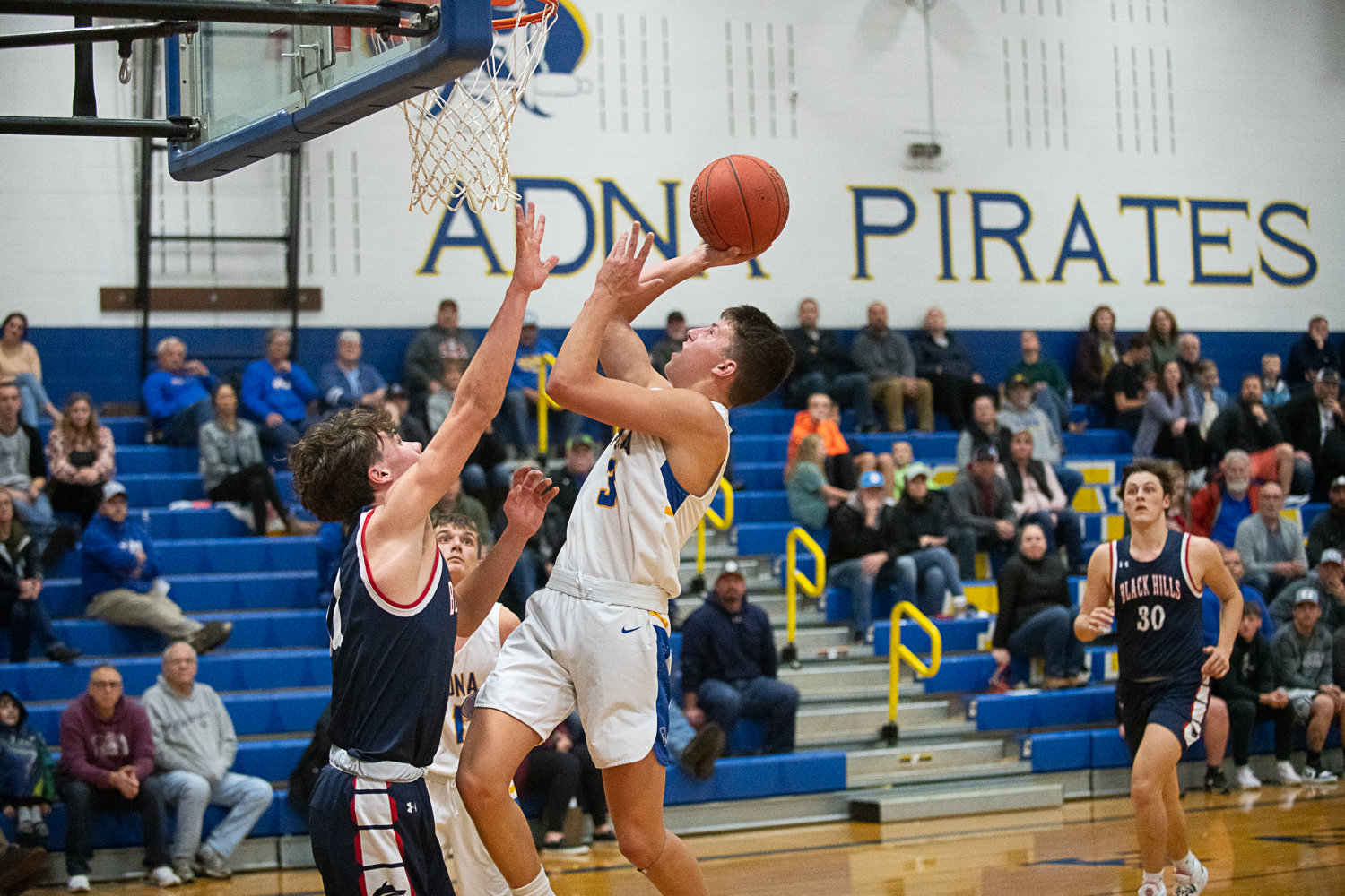 Braeden Salme puts up a shot through contact during Adna's 67-60 win over Black Hills to open the season on Nov. 29.