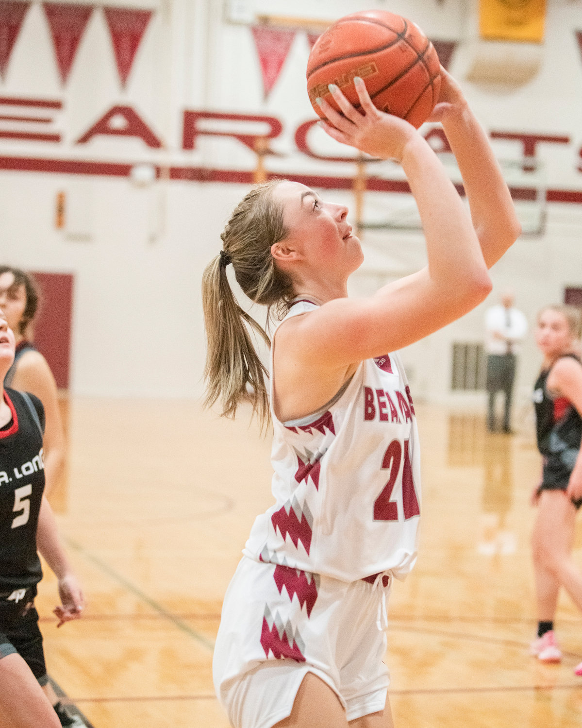 Bearcat senior Morgan Rogerson (21) scores Tuesday night during a game against R.A. Long at W.F. West High Shool in Chehalis.