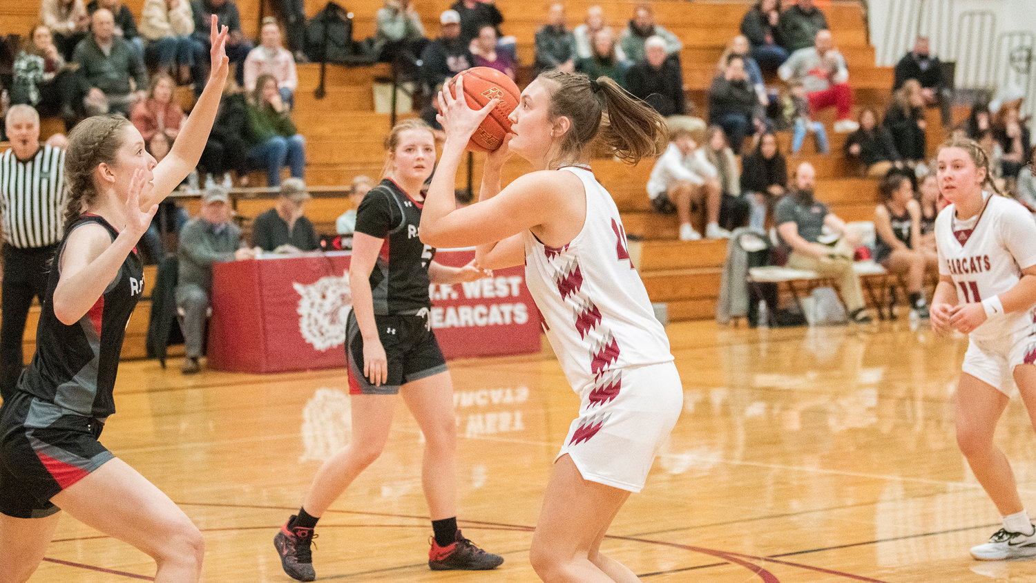 Bearcat sophomore Julia Dalan (44) looks to shoot during a game against R.A. Long Tuesday night in Chehalis.