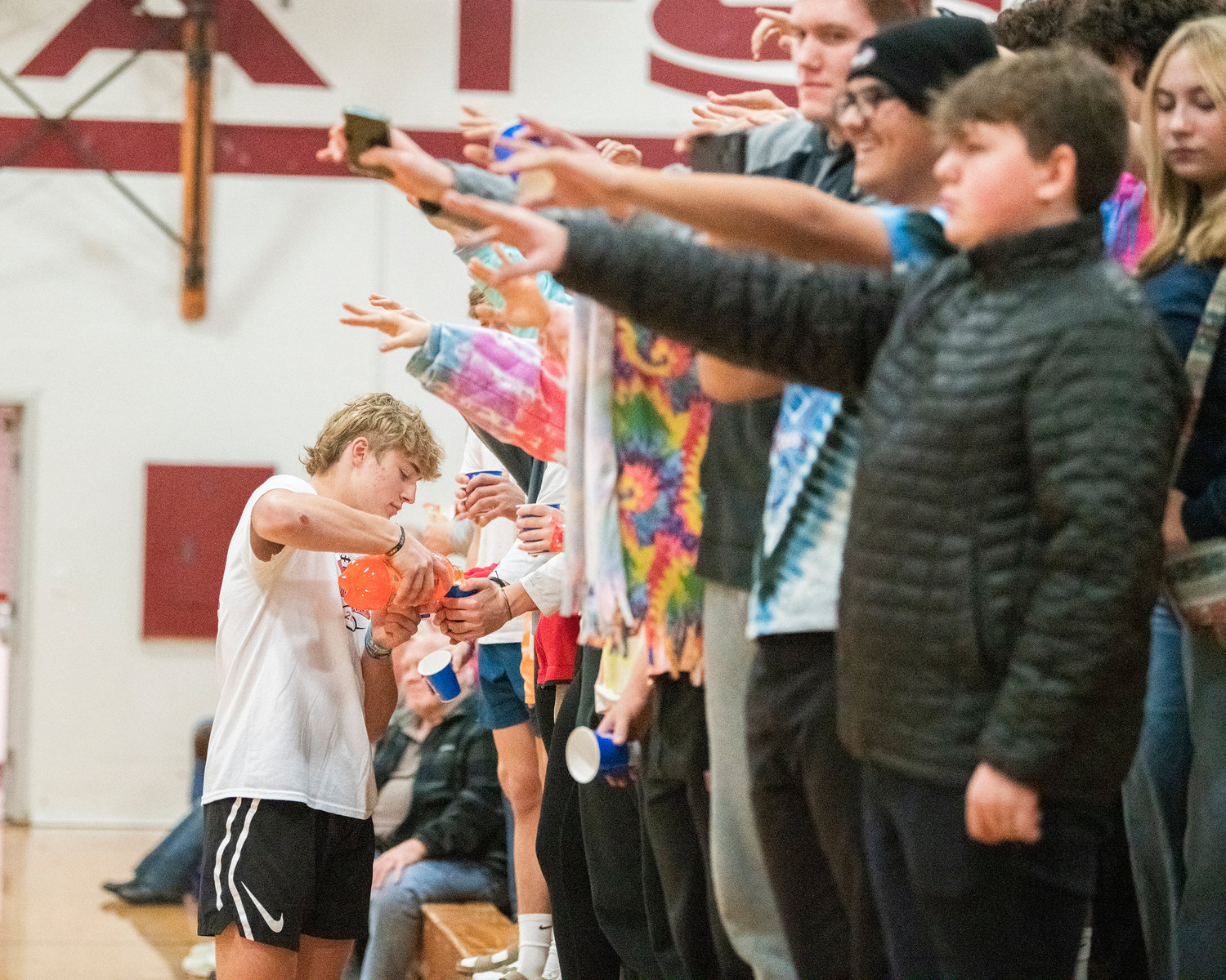 Cups are poured after hoops are made at halftime during a basketball game in Chehalis Tuesday night.