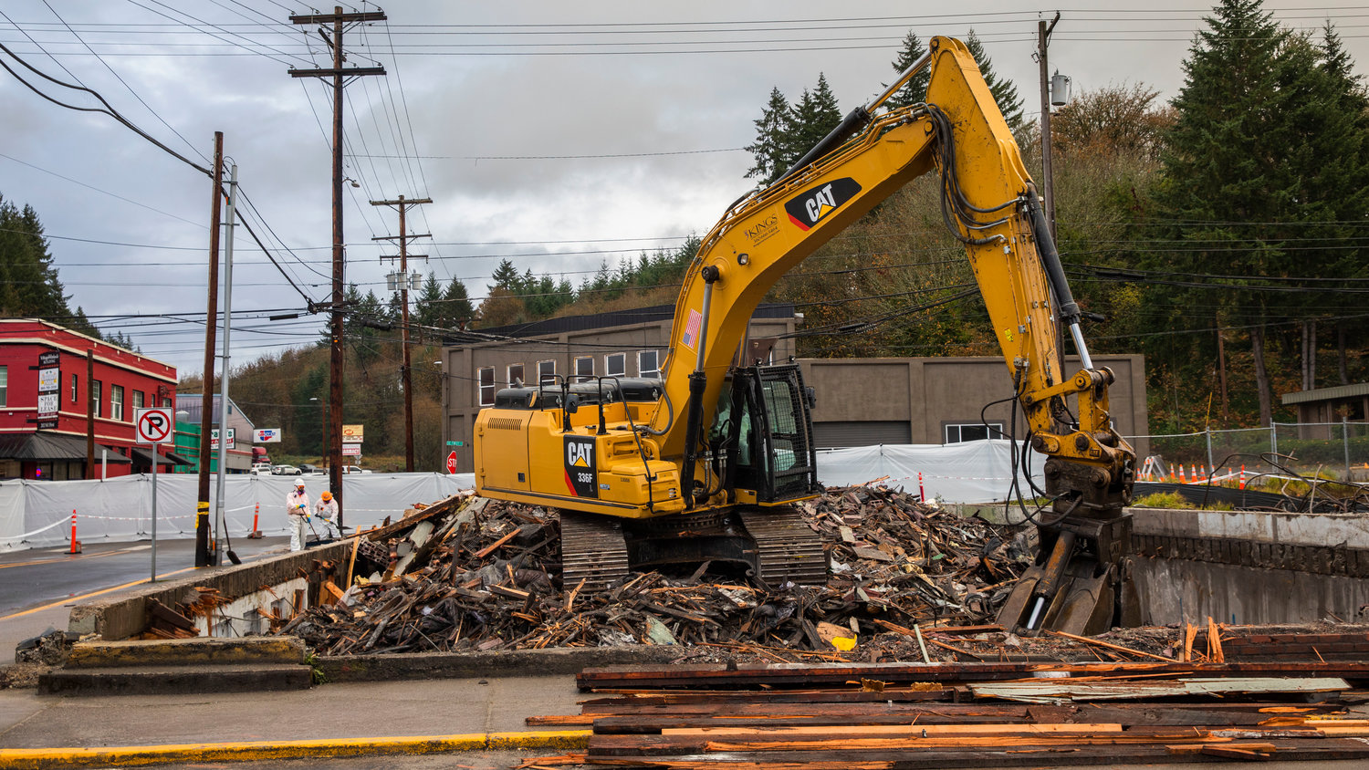 Demolition crews work to demolish the Winlock Haunted Hostel B&B and Hotel following a structure fire in the building.