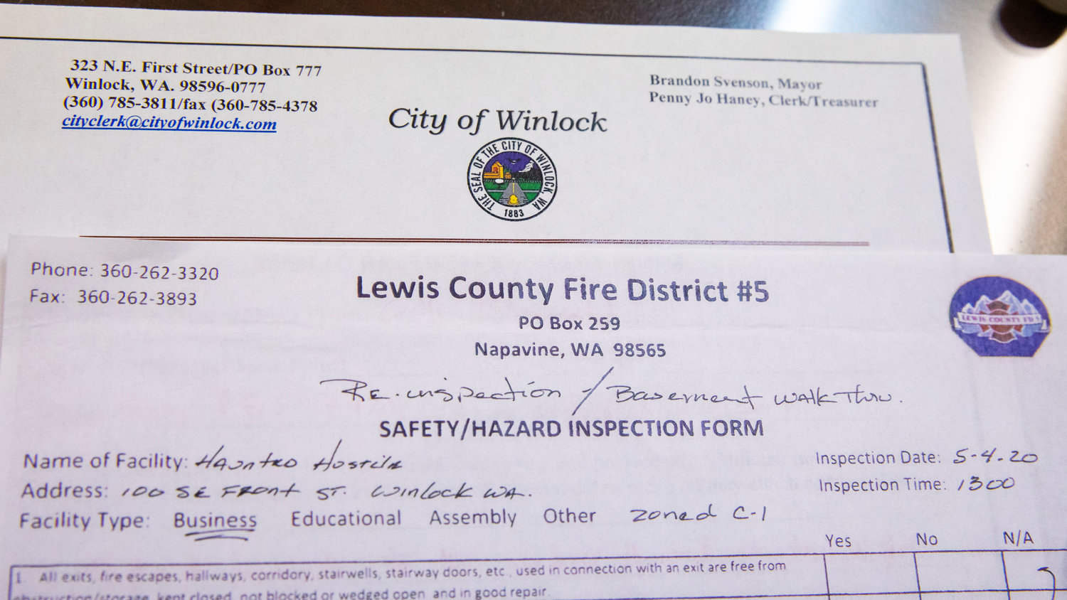 A Lewis County Fire District 5 Safety and Hazard Inspection Form on the Winlock Haunted Hostel B&B and Hotel from 2020 sits on Brandon Svenson’s desk.