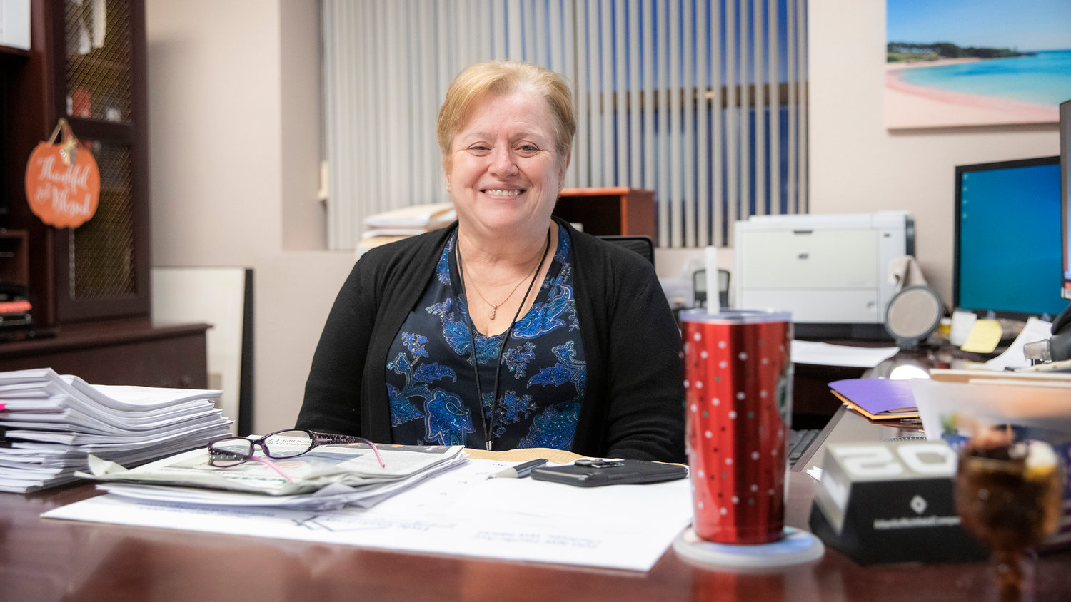 Lewis County Assessor Dianne Dorey smiles for a photo in her office Tuesday evening in Chehalis.