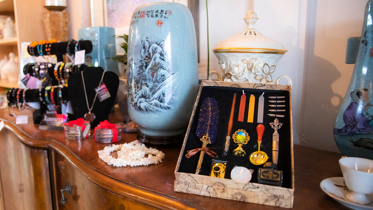 Ink pens, stamps, art, jewelry and other decor sits on display at The Victorian Showcase and Steampunk Emporium in downtown Centralia on Friday.