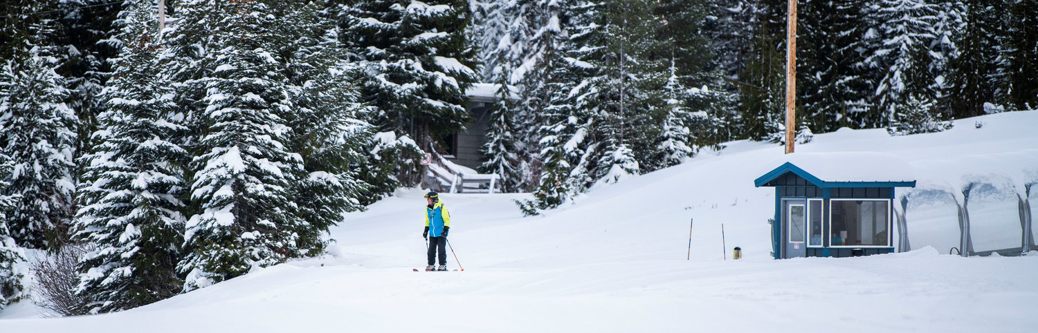 A skier moves between trees and structures at the White Pass Ski Area on Thursday.