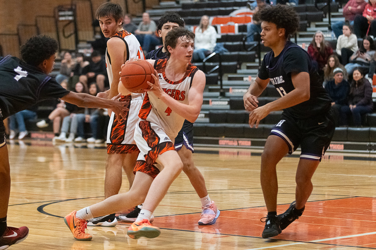 Aiden Haines blows past one defender and prepares to take on a second during the fourth quarter of Centralia's 56-34 loss to Heritage on Dec. 2.