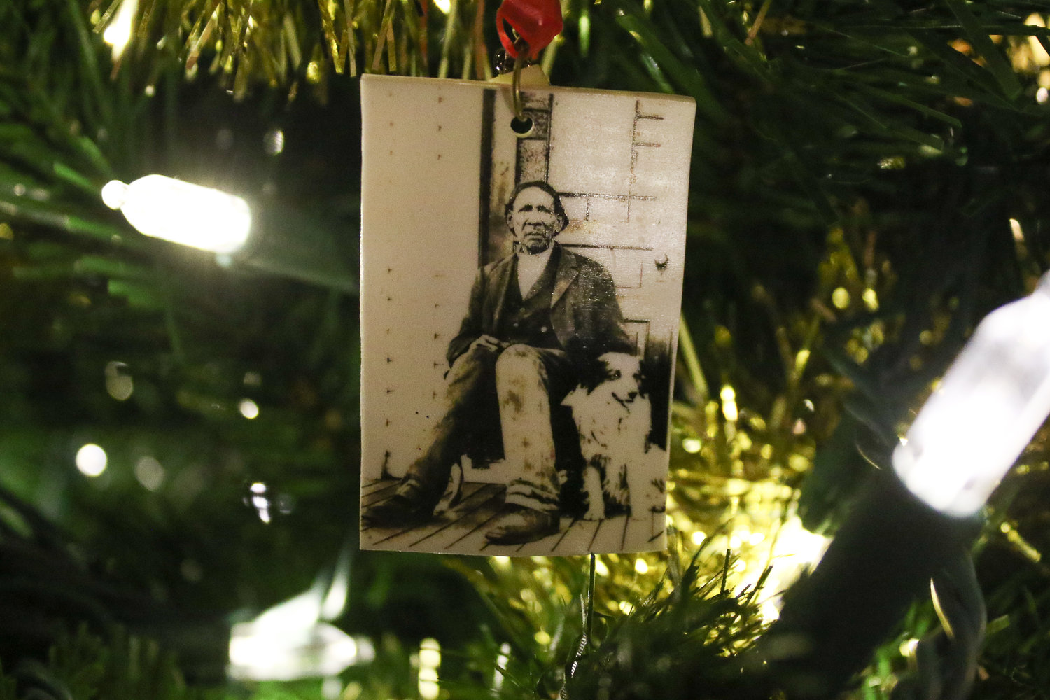 A homemade Christmas tree ornament featuring a photograph of George Washington sits in Kerry Serl's tree. Serl, along with Brian Mittge, authored Washington's biography and just released the book's second edition.