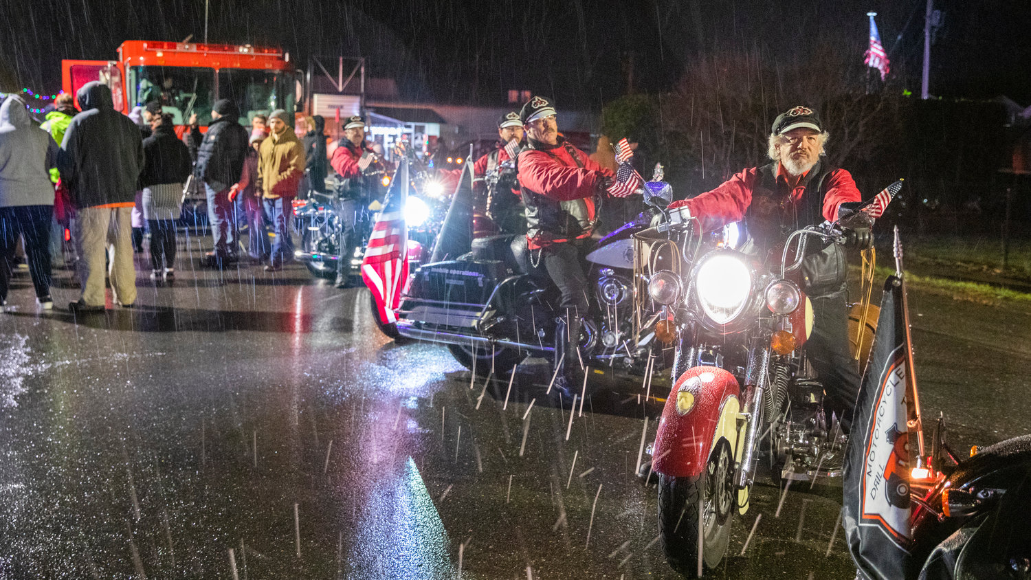 Members of the Tenino Motorcycle Drill Team perform along Sussex Avenue East Friday night during the downtown Tenino Christmas tree lighting.