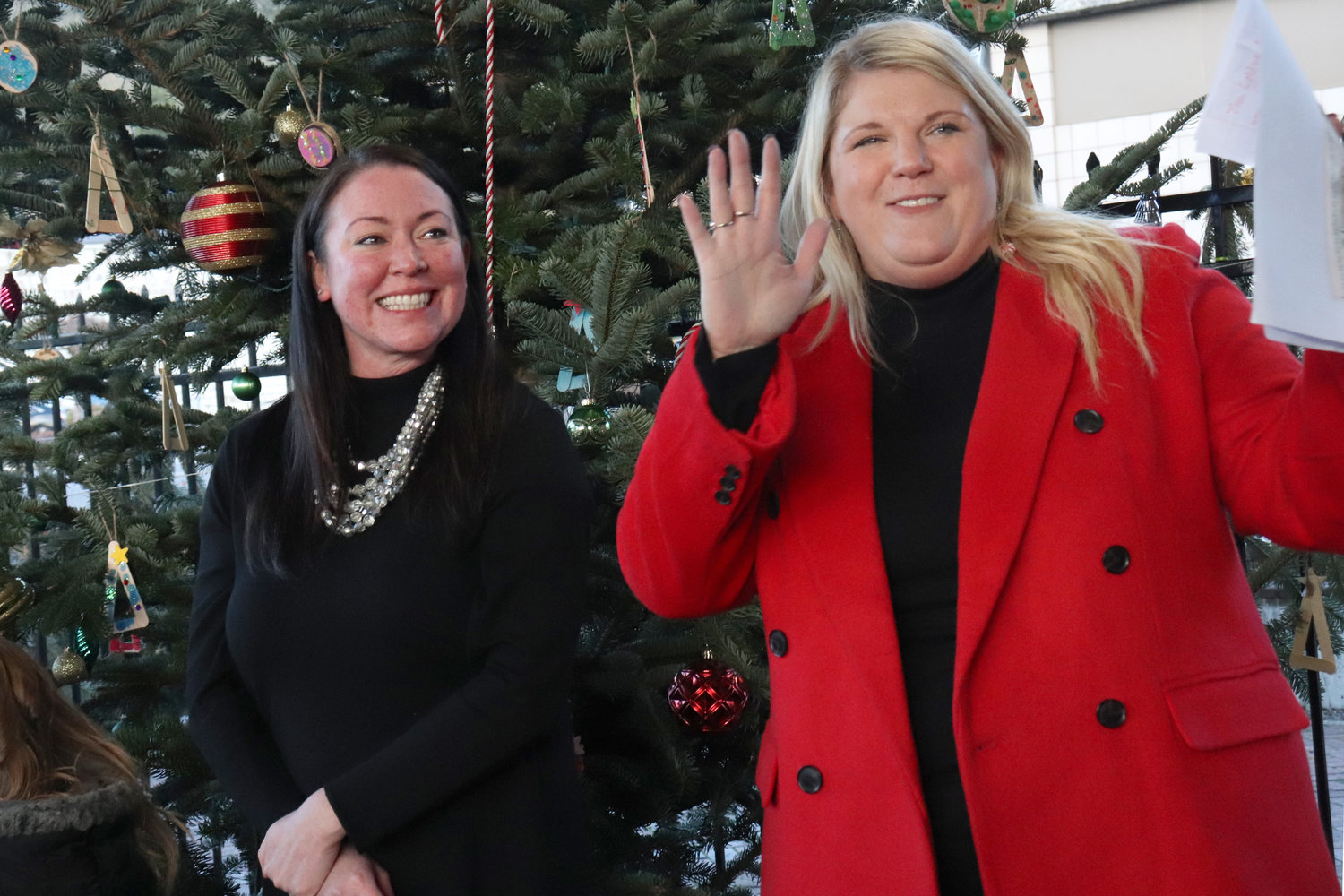 Chehalis City Councilor Kate McDougall and Experience Chehalis Executive Director Annalee Tobey stand in front of the City of Chehalis’ Christmas tree outside of the Lewis County Historical Museum on Saturday.
