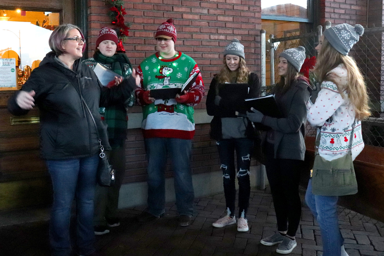 Carolers with Westminster Presbyterian Church sing during the City of Chehalis Christmas Tree Lighting ceremony outside the Lewis County Historical Museum on Saturday.