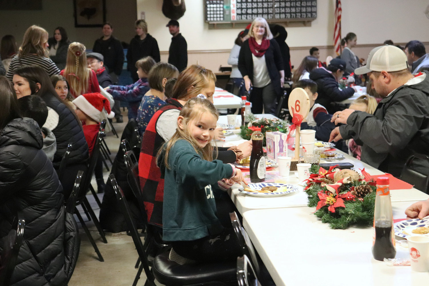 Families enjoy breakfast during a Breakfast with Santa event at the Moose Family Center in Centralia on Saturday. The event was a fundraiser for Mary Bridge Children’s Hospital.