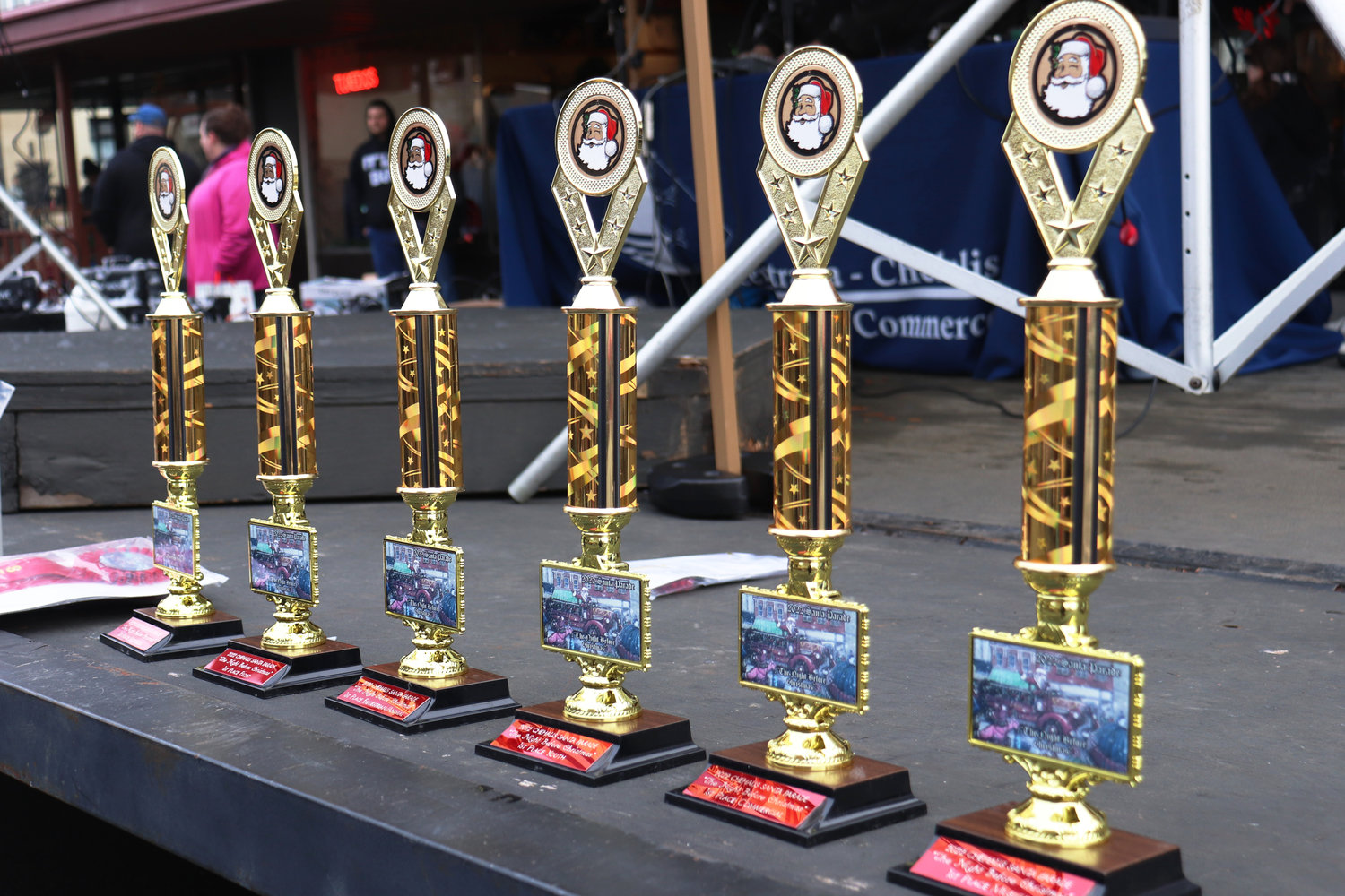 Awards for different categories of Santa-parade participants, including marching band, commerce, youth displays and floats, sits on the Centralia-Chehalis Chamber of Commerce’s stage in downtown Chehalis on Saturday.